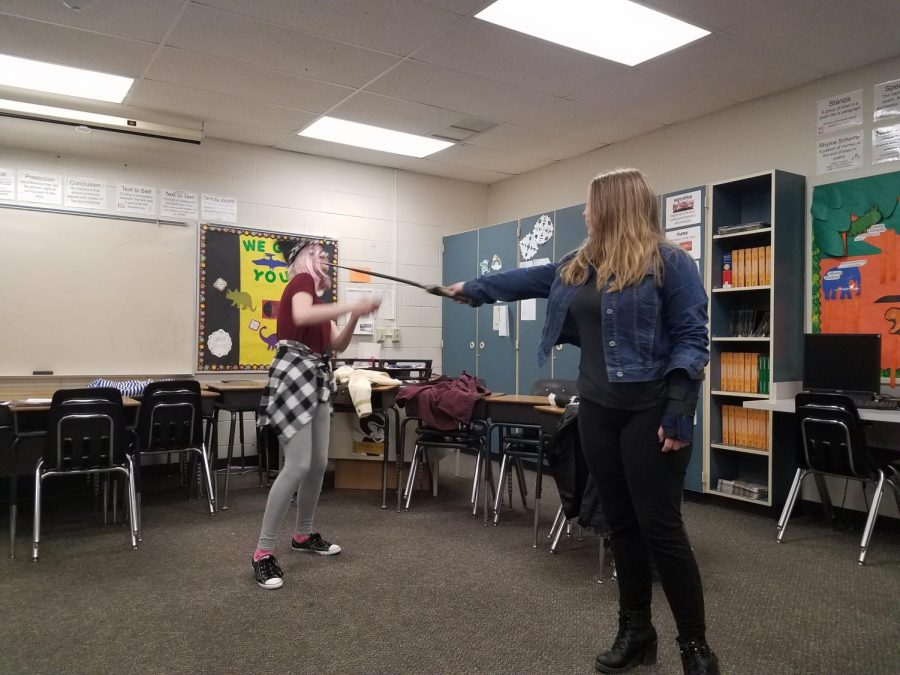 Aubrey Williams and Rhea Livingston participating in the Economics Day activity Community Theater.
