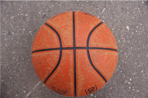 A basketball on cement.