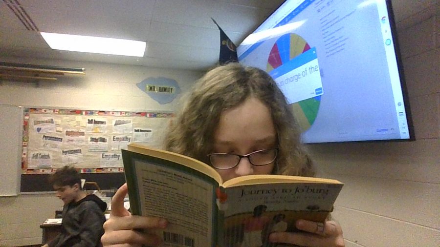 A picture of Jaycie reading a book