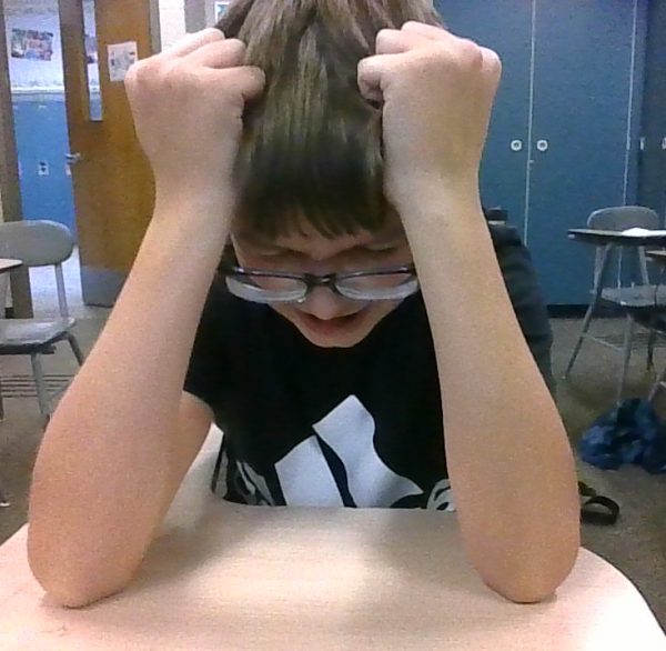 A student pulling out his hair in stress.