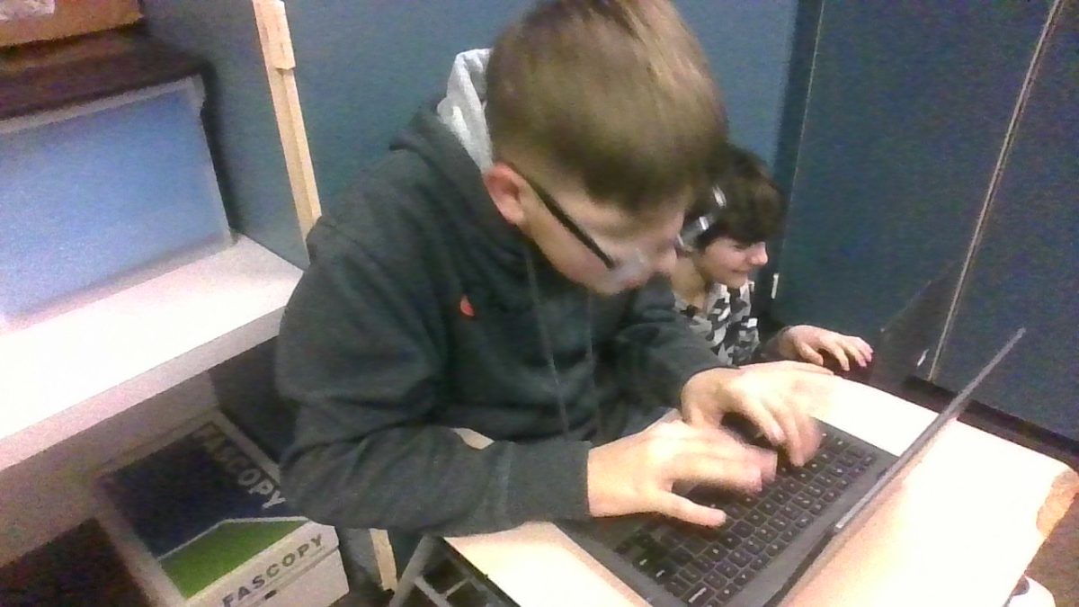 A child working hard on his beat story.