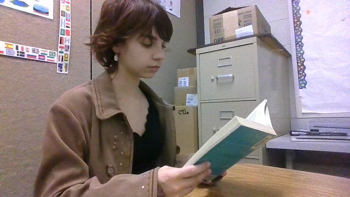 Keira Ogleby reading a book