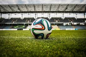 Photo of a soccer ball on a soccer field 