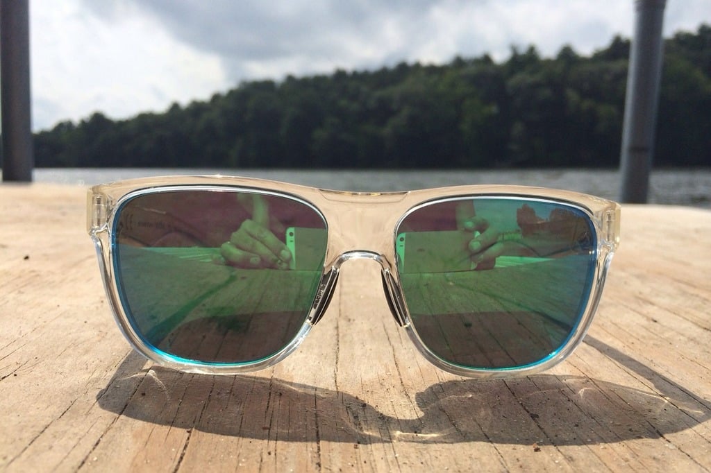 Sunglasses sitting on a dock 
